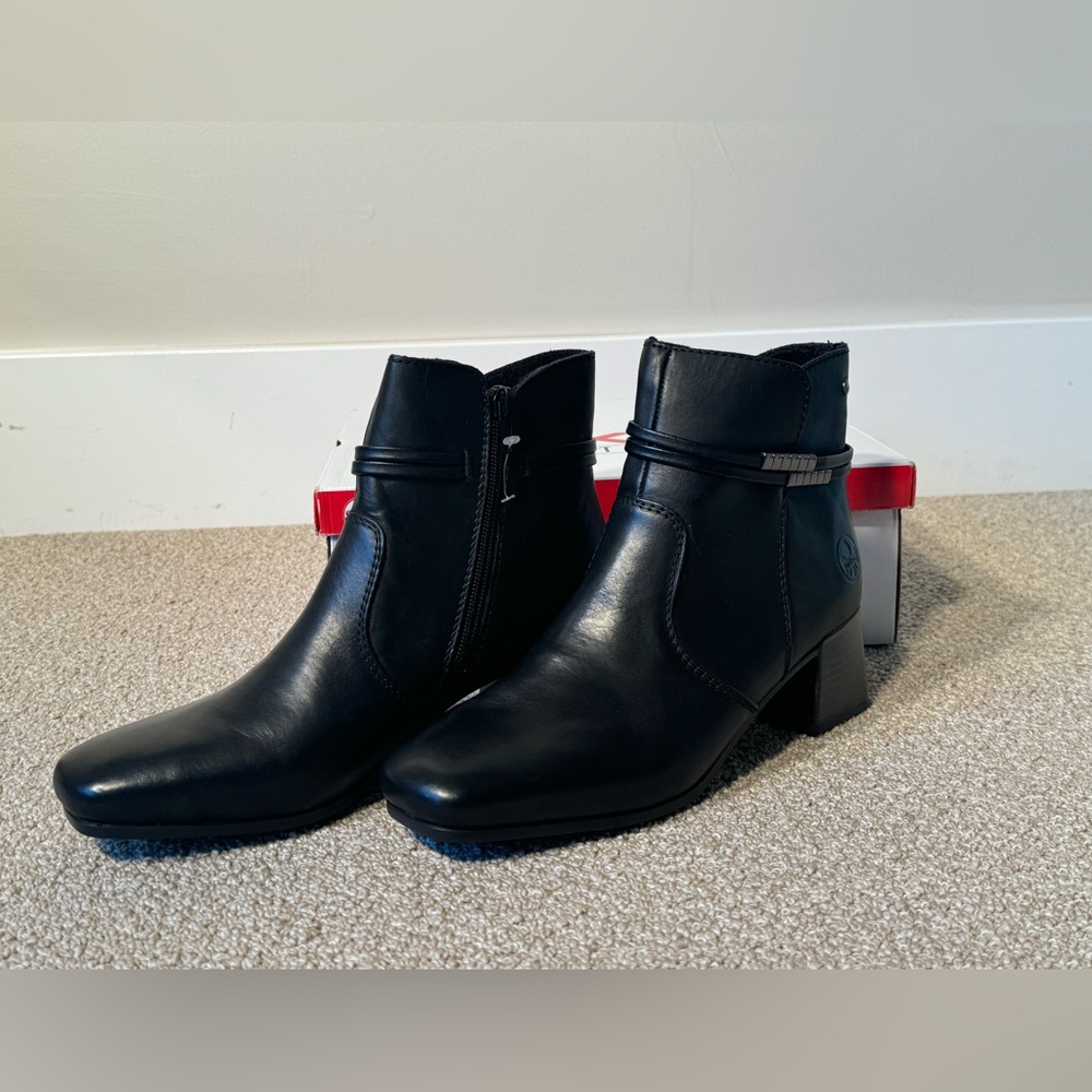 Rieker brand black booties w beautiful detail.  NWT & box. Size 38. Comfort!!